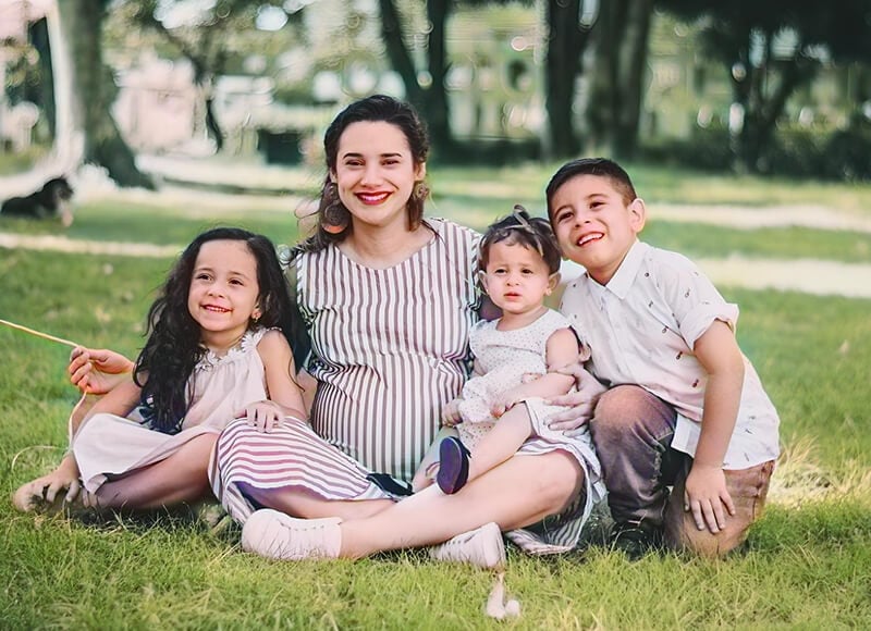 A restored and colorized version of the family phot with vibrant natural colors and clear details